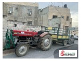تراكتور مع ترلة مع عود حراث
