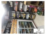 رفوف محل + ثلاجة + بضاعة 