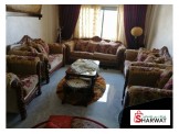 طقم كنب بحالة ممتازه جدا مع طاولة وسط جديده 